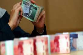 RUPIAH/US$: Tarung Adu Kuat Sentimen Positif dan Negatif