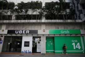 Singapura Jatuhkan Denda US$9,5 Juta ke Grab dan Uber