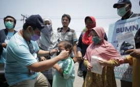 Tebar Masker, Pupuk Indonesia Ajak Masyarakat Disiplin Protokol Kesehatan