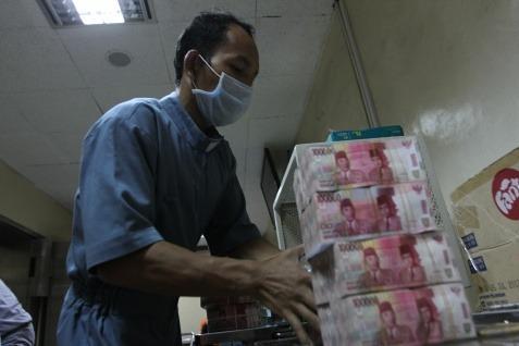  Rupiah Menunggu Inflasi Desember