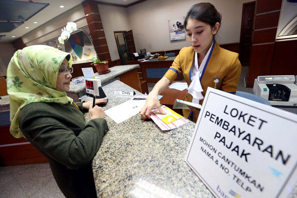  FOTO: Pertumbuhan Ekonomi Direvisi Perbankan Tetap Optimistis