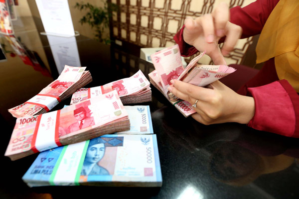  FOTO: Rupiah Menguat Di Akhir Perdagangan Pekan Ini