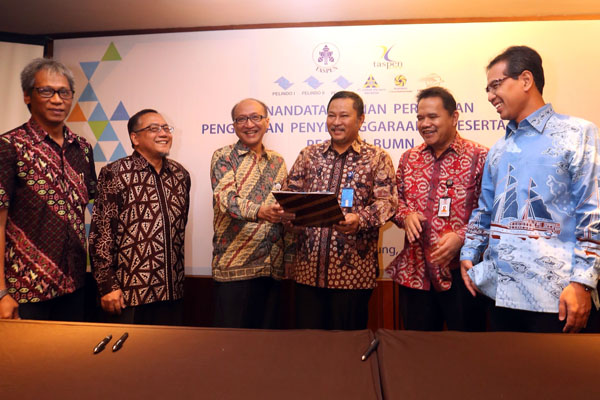  FOTO: Taspen Alihkan Pengelolaan Tabungan Hari Tua 5 BUMN ke Anak Usaha