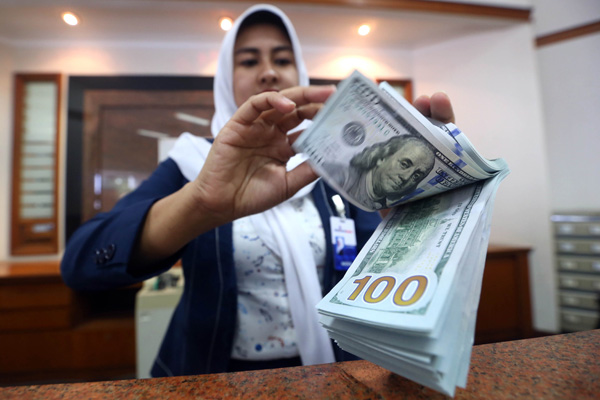  FOTO: KURS RUPIAH 5 Mei: Ditutup Melemah di Rp13.062/US$