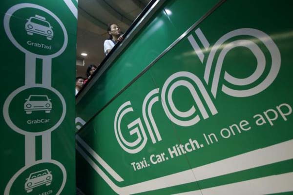 Logo salah satu angkutan online/Reuters-Edgar Su