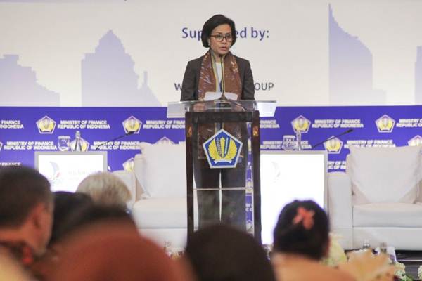 Menteri Keuangan Sri Mulyani menyampaikan keynote speech dalam seminar Managing Urbanisation for Sustainable Cities, di Jakarta, Selasa (19/12)./JIBI-Felix Jody Kinarwan