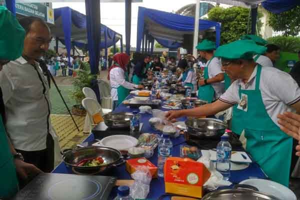  PLN Sumbagsel Masak Nasi Goreng Pakai Kompor Induksi Pecahkan Rekor MURI