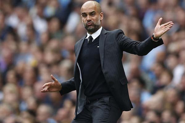  Ribut dengan Pelatih Wigan, Suporter MU Minta Guardiola Dihukum