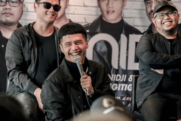 Muhammad Yusuf Nur Ubay, Vokalis Baru Pengganti Giring Tersenyum saat Konferensi Pers, Rabu (6/2/2019)/ Bisnis