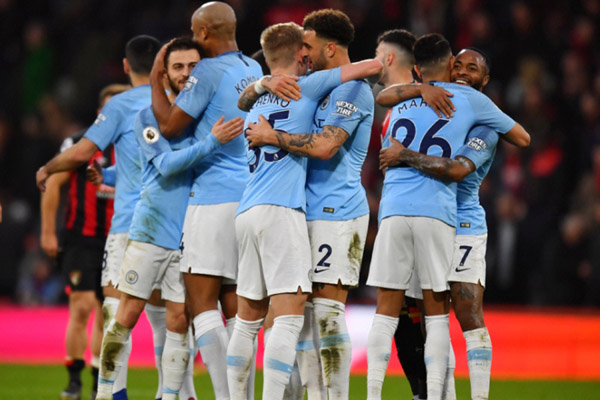 Para pemain Manchester City merayakan kemenangan atas Bournemouth./Reuters-Dylan Martinez