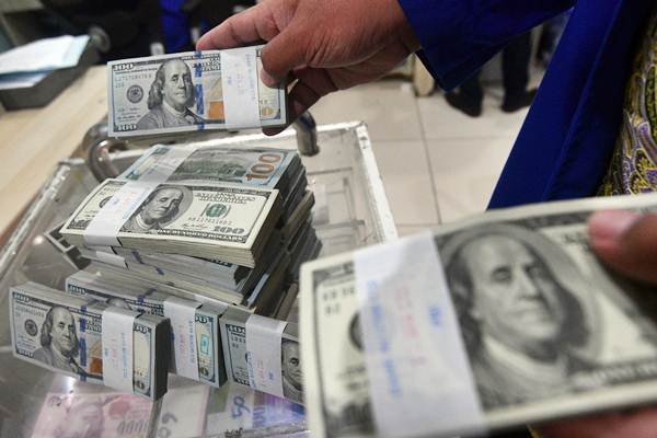  Dolar AS Terkerek Isu Tensi AS-China, Rapat The Fed Membebani