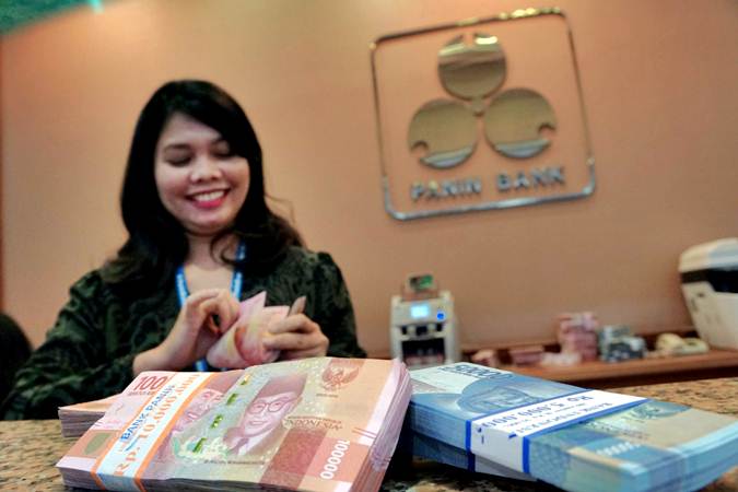  Kurs Tengah BI Melemah 27 Poin, Rupiah Terkuat Kedua di Asia