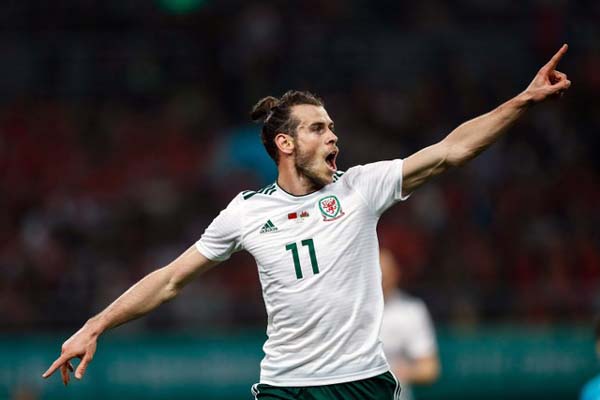 Gareth Bale dalam balutan jersey Wales/Reuters