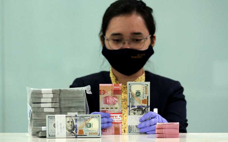  PENUNDAAN PEMBICARAAN STIMULUS AS   : Dolar Lunglai, Rupiah Berjaya