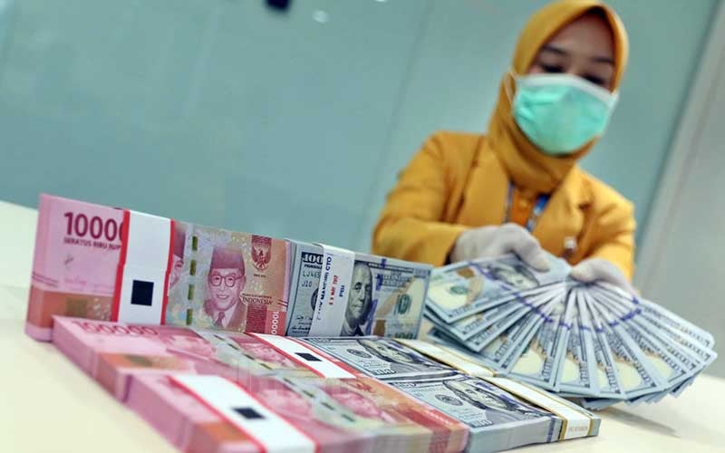  Tertekan Dolar AS, Sentimen Vaksinasi Belum Dorong Rupiah 