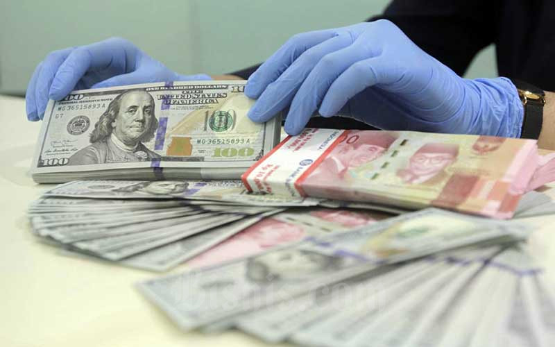  Dolar AS Rebound, Rupiah Dibuka Turun Tipis