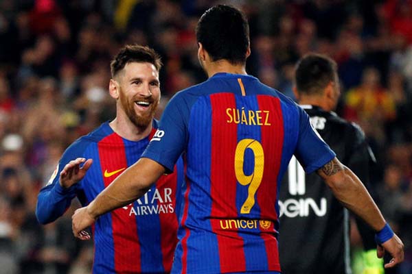 Lionel Messi (kiri) dan Luis Suarez ketika masih bersama memperkuat Barcelona di La Liga Spanyol./Reuters