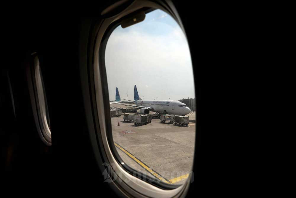 Pesawat milik maskapai penerbangan Garuda Indonesia terparkir di Bandara Internasional Soekarno-Hatta, Tangerang, Banten, Selasa (21/6/2022). Bisnis/Eusebio Chrysnamurti