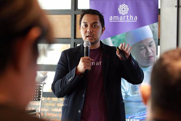 CEO dan Founder PT Amartha Mikro Fintek (Amartha) Andi Taufan Garuda Putra, memberikan paparan saat konferensi pers #Amartha8eyond di Jakarta, Selasa (22/5/2018).JIBI-Dwi Prasetya