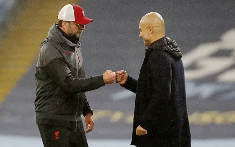 Pep Guardiola (kanan) dan Jurgen Klopp./Antara/Reuters