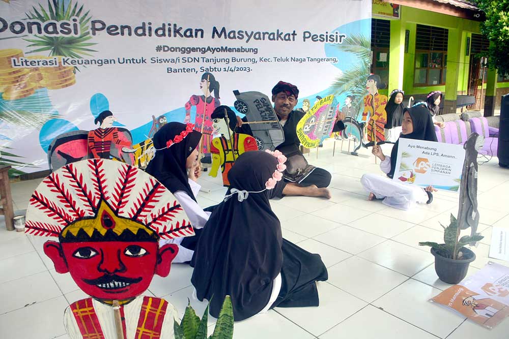  JMI Berikan Donasi Pendidikan Masyarakat Pesesir Di SDN Tanjung Burung Kabupaten Banten Lewat Media Dongeng Perbankan