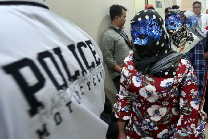Korban perdagangan orang dihadirkan saat rilis pengungkapan tindak pidana perdagangan orang di Jakarta, Selasa (9/4/2019)./Bisnis-Nurul Hidayat