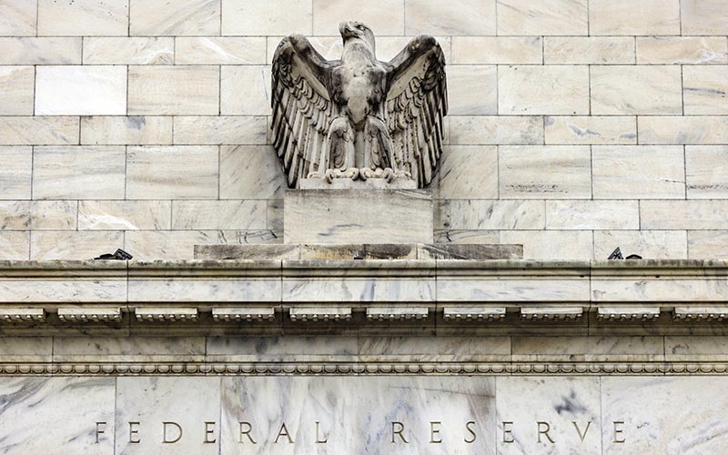 Gedung bank central Amerika Serikat atau The Federal Reserve di Washington, Amerika Serikat, Minggu (19/12/2021). Bloomberg/Samuel Corum