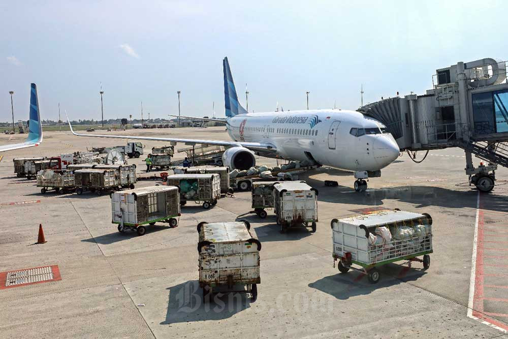 Pesawat milik maskapai penerbangan Garuda Indonesia terparkir di Bandara Internasional Soekarno-Hatta, Tangerang, Banten, Selasa (21/6/2022). Bisnis/Eusebio Chrysnamurti