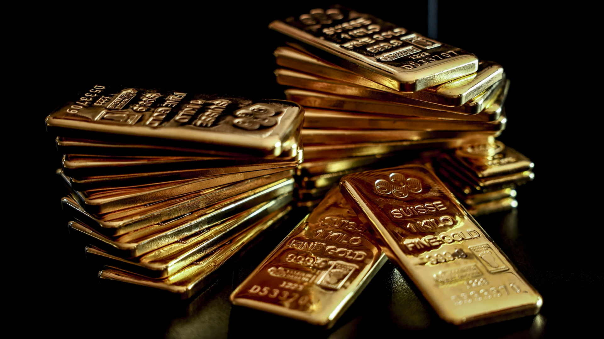 Tumpukan emas batangan 1 kilogram di YLG Bullion International Co. Bangkok, Thailand pada Jumat (22/12/2023). - Bloomberg/Chalinee Thirasupa
