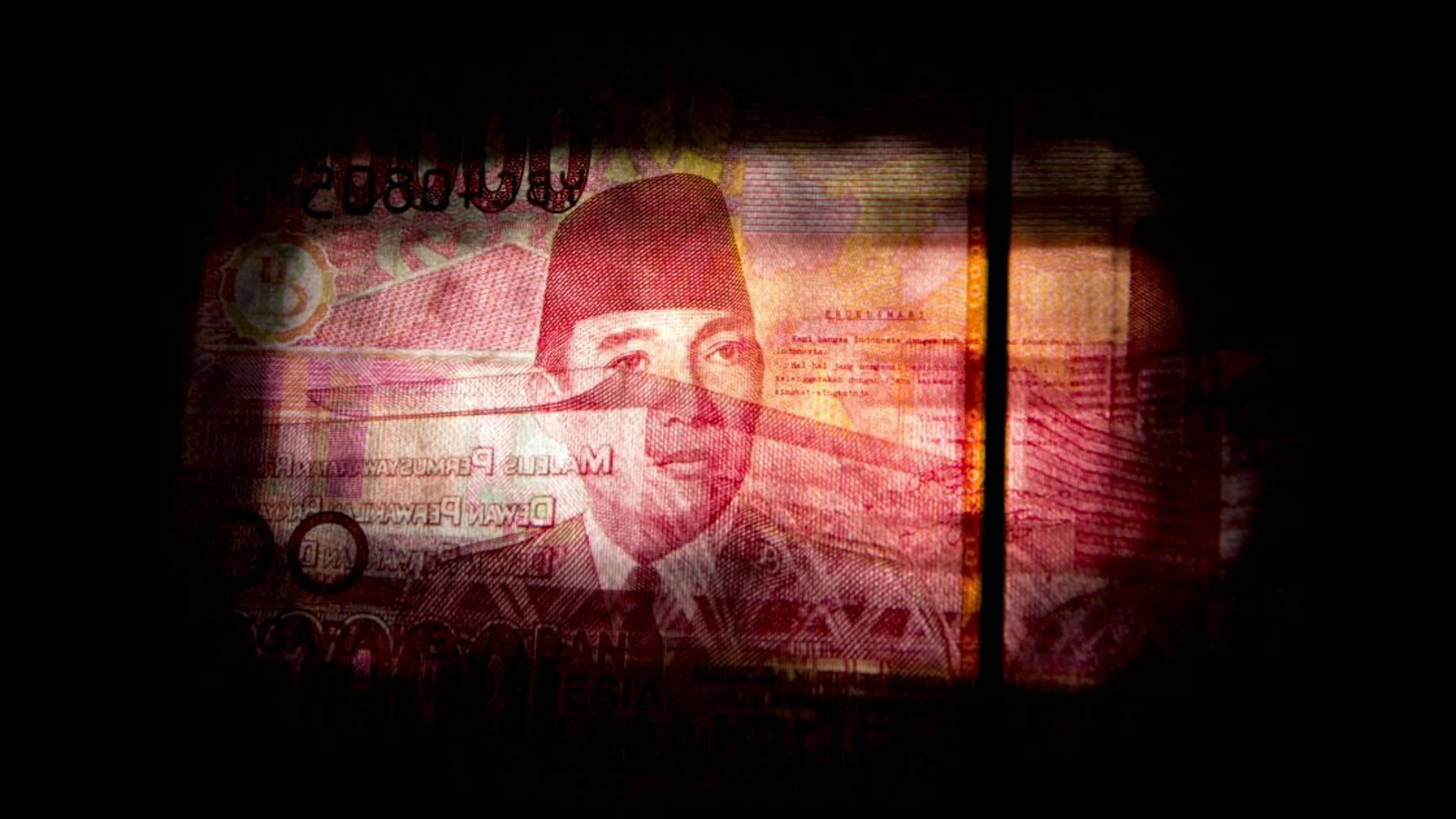 Potret wajah Mantan Presiden Sukarno dalam uang lembar Rp100.000. - Bloomberg/Brent Lewin