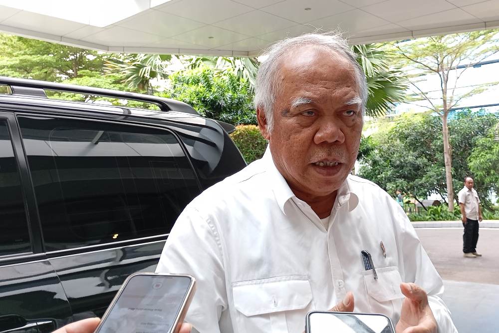 Menteri Pekerjaan Umum dan Perumahan Rakyat (PUPR), Basuki Hadimuljono saat ditemui di Kantor Kementerian PUPR, Jakarta, Senin (8/7/2024) - BISNIS/Alifian Asmaaysi.