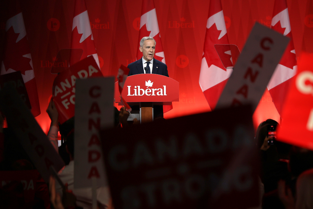 Pemimpin Partai Liberal Kanada Mark Carney berpidato dalam pengumuman pemimpin partai tersebut di Ontario, Kanada pada Minggu (9/3/2025) waktu setempat. / Bloomberg-David Kawai