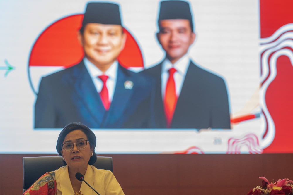 Menteri Keuangan Sri Mulyani Indrawati dalam konferensi pers di Jakarta, Jumat (16/8/2024). / Bloomberg-Rosa Panggabean