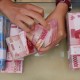 Kurs Tengah Rupiah Makin Melemah ke Rp11.407/US$