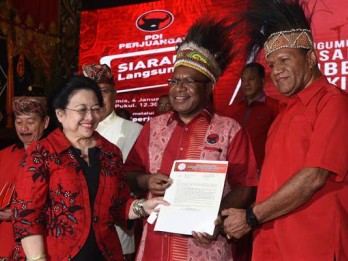 Menguji Faktor Jokowi di Pilgub Papua 2018