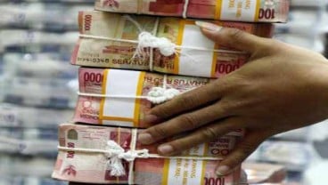 Rupiah Masih Lewati Rp14.000 per Dolar AS, Ekonom: Efek Sentimen Global