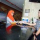 Mandiri Gandeng Posindo Perluas Layanan Top Up E-Money