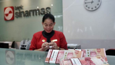 Dolar AS Flat, Rupiah Fluktuatif di Pasar Spot