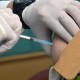 OJK, Polda, Kadin dan Iwapi Riau Salurkan 1.911 Dosis Vaksin Covid-19