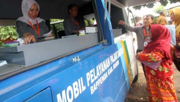 RESENTRALISASI TARIF PAJAK & RETRIBUSI : Pusat ‘Hukum’ Daerah