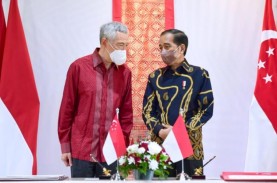 Jokowi Teken UU Ekstradisi dengan Singapura, Buronan…
