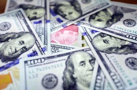 Rupiah Ditutup Melemah ke Rp15.450, Mayoritas Mata…