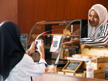Resmi Diimplementasikan, Ini Daftar Bank yang  Layani Transaksi QRIS di Malaysia