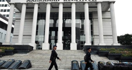 Polisi berjaga di sekitar Jalan Merdeka Barat, Jakarta, Jumat (14/6/2019)./Bisnis-Felix Jody Kinarwan