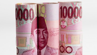 Rupiah Ditutup Lesu setelah BI Tahan Suku Bunga Acuan 2 Bulan Beruntun