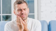 Penyebab dan Cara Mengatasi Gigi Impaksi