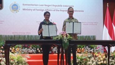 7 Poin MoU Perlindungan WNI di Sektor Jasa Keuangan Antara Kemlu dan OJK