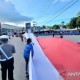 Pembentangan Bendera Merah Putih 12,77 Kilometer di Manokwari Raih Rekor Muri