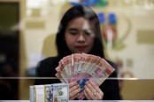 Rupiah Dibuka Menguat Dekati Level Rp14.000, Dolar AS Juga Perkasa