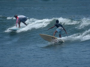 Warga bermain selancar di Pantai Pancer, Puger, Jember, Jawa Timur